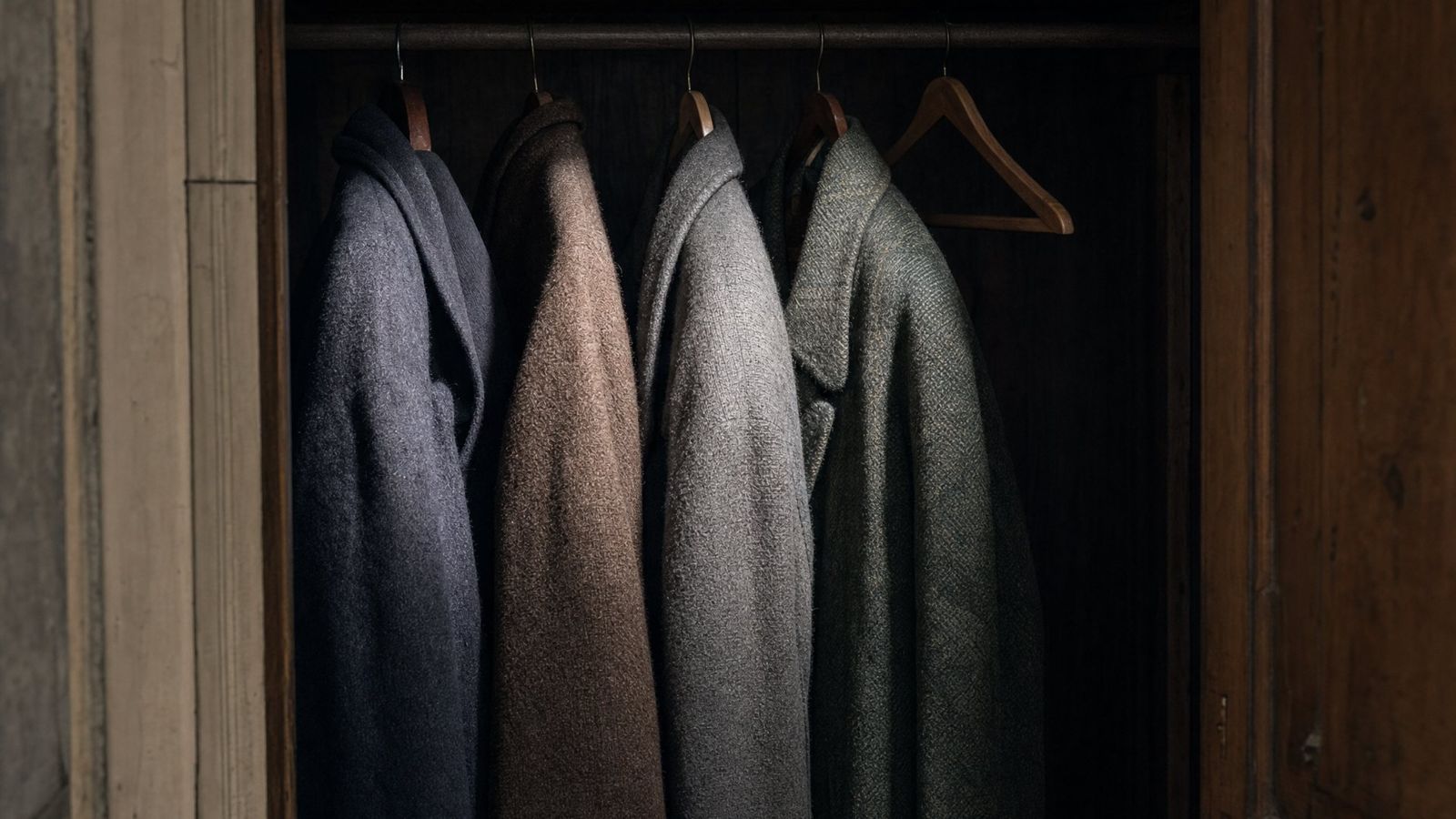 Wool coats in a dark closet, a frame from Odorama Cities